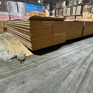 New MDF boards stacked in a warehouse