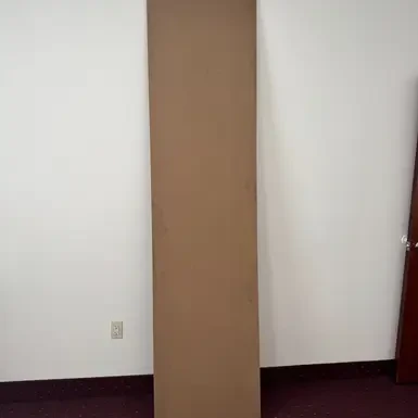 Full-length MDF board shown upright against a wall